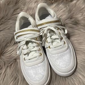 Brand new Nike air forces with gold color women size 9.5